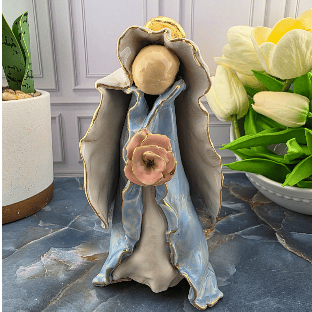 A ceramic mary figurine with a light blue and gray robe, gold trim, and a pink rose, Sister Dulce Gift Shop, Shepherds Staff, Religious Store, Cypress Springs Mercedarian Prayer Center, Catholic,
