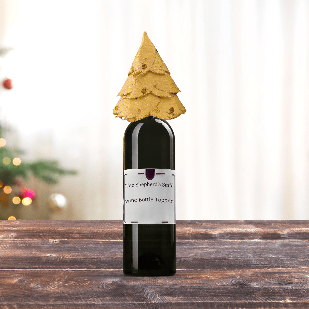 a decorative golden-yellow Christmas tree wine bottle topper, Sister Dulce Gift Shop, Shepherds Staff, Religious Store, Cypress Springs Mercedarian Prayer Center, Catholic,