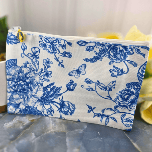 A fabric zip pouch with a blue floral toile, Sister Dulce Gift Shop, Shepherds Staff, Religious Store, Cypress Springs Mercedarian Prayer Center, Catholic, new item, make up bag