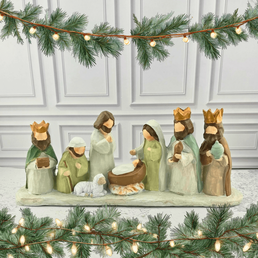 A painted wooden-style Nativity scene figurine set, featuring Mary, Joseph, baby Jesus in a manger, three wise men, and a small white sheep, Sister Dulce Gift Shop, Shepherds Staff, Religious Store, Cypress Springs Mercedarian Prayer Center, Catholic, christmas decor
