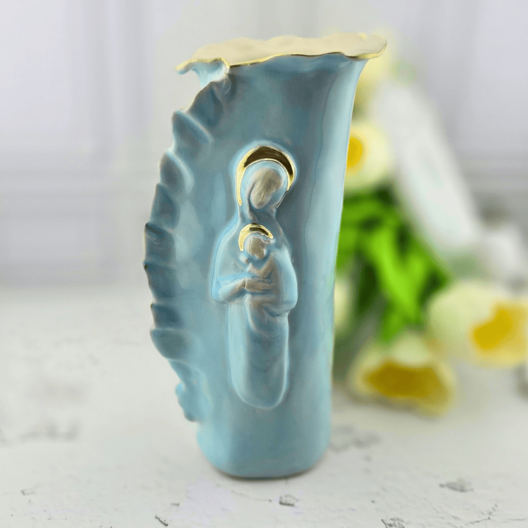 A light blue ceramic figurine of the Virgin Mary holding baby Jesus, featuring gold accents on the halo and top rim, Sister Dulce Gift Shop, Shepherds Staff, Religious Store, Cypress Springs Mercedarian Prayer Center, Catholic, sacred treasures, home decor, new item, popular item