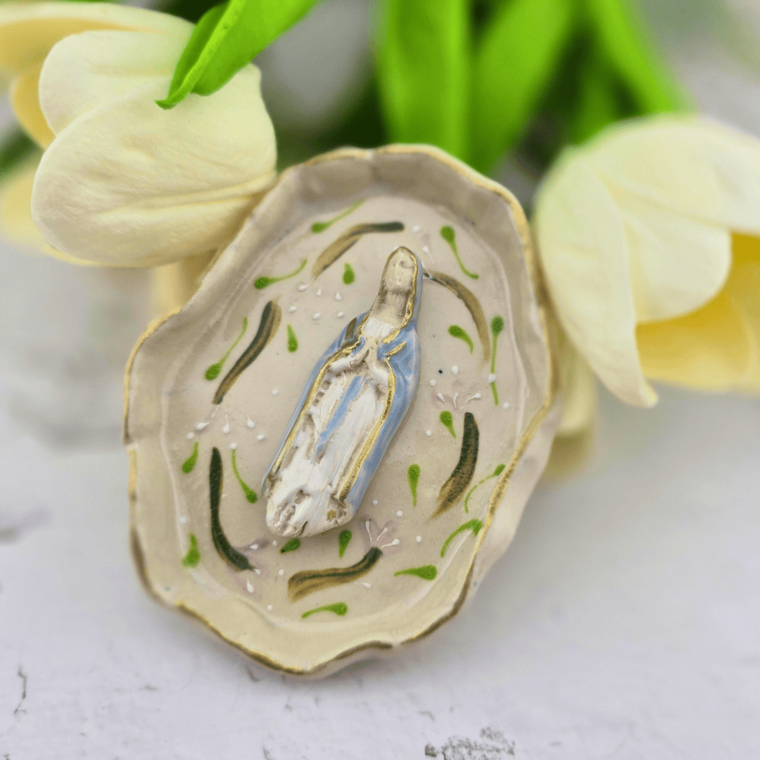 A decorative ceramic oyster shell figurine featuring a small painted Virgin Mary statue inside, our lady of the rosary, Sister Dulce Gift Shop, Shepherds Staff, Religious Store, Cypress Springs Mercedarian Prayer Center, Catholic, sacred treasures, new item, popular item, 