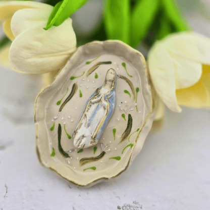 A decorative ceramic oyster shell figurine featuring a small painted Virgin Mary statue inside, our lady of the rosary, Sister Dulce Gift Shop, Shepherds Staff, Religious Store, Cypress Springs Mercedarian Prayer Center, Catholic, sacred treasures, new item, popular item, 