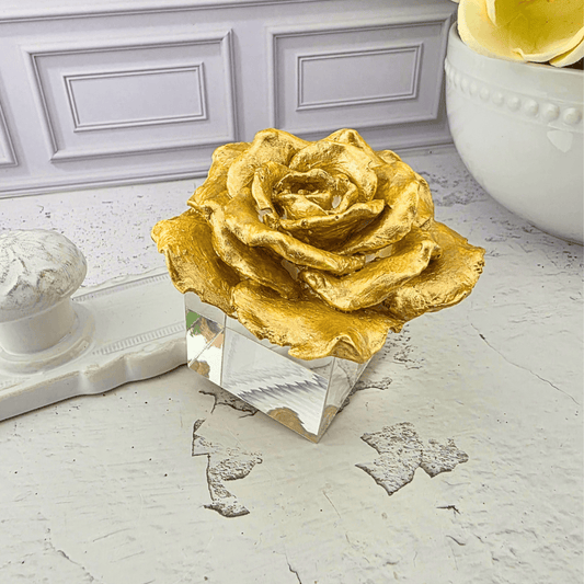 A decorative golden rose sculpture displayed on a faceted clear crystal base, paper weight, home decor, for young adults, gift for her, Sister Dulce Gift Shop, Shepherds Staff, Religious Store, Cypress Springs Mercedarian Prayer Center, Catholic, new item, popular item