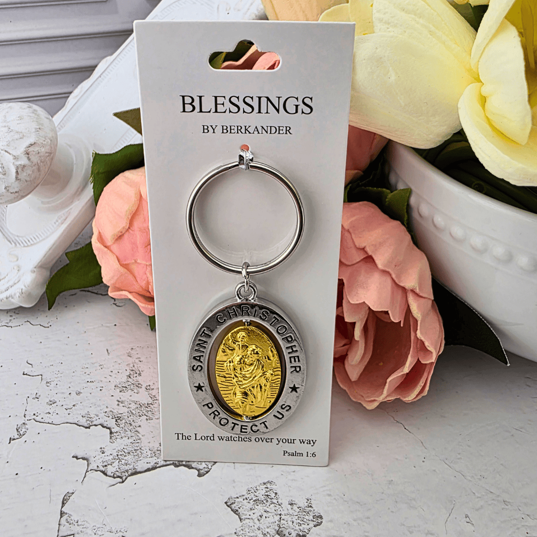 A revolving Saint Christopher keychain with a gold-toned medallion and silver-toned ring, Sister Dulce Gift Shop, Shepherds Staff, Religious Store, Cypress Springs Mercedarian Prayer Center, Catholic, new item, popular item, new driver, gift for him, young adult