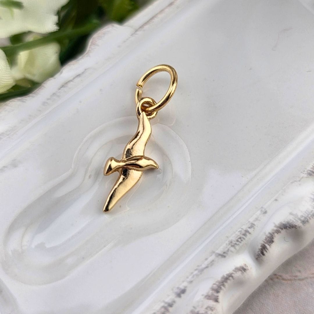 gold holy spirit charm for charm necklace and bracelet, sister dulce, bows, shepherds staff gift shop