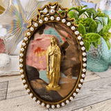 Oval Pearl and Gold Frame With Handmade Reliefs Virgin Mary on Pink Green and Taupe Background Artwork Raz Imports